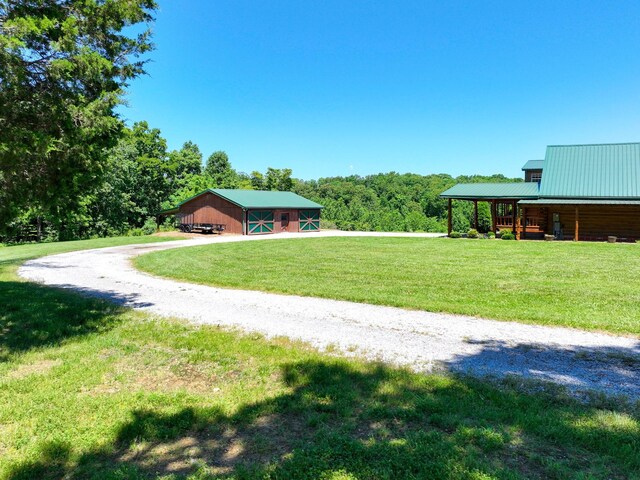 375 Good Hope Rd, Leoma, TN 38468 - view of green lawn featuring driveway and an outbuilding