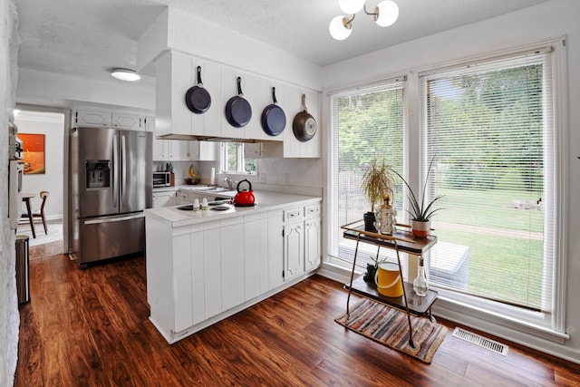 5024 Lakeridge Dr, Old Hickory, TN 37138 - kitchen featuring stainless steel fridge, a peninsula, dark wood-style floors, and a chandelier