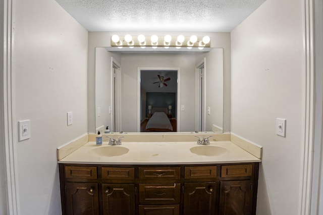5024 Lakeridge Dr, Old Hickory, TN 37138 - full bathroom with double vanity, a textured ceiling, and ensuite bathroom