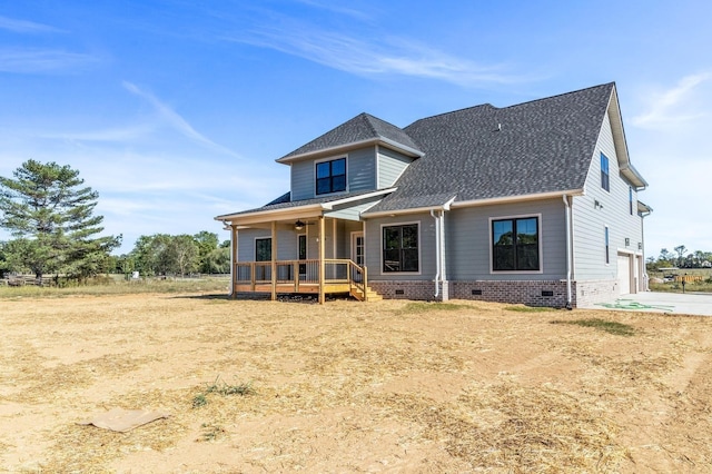 view of front of property with a garage, crawl space, a deck, a shingled roof, and ceiling fan