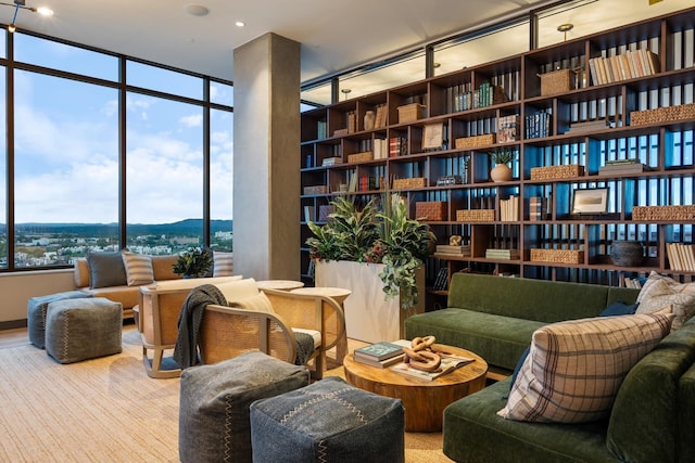 living area featuring a mountain view and floor to ceiling windows