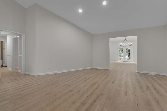 4048 Lancashire Dr, Antioch, TN 37013 - unfurnished living room featuring a chandelier, light wood-style flooring, baseboards, and recessed lighting