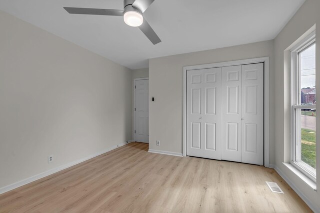 4048 Lancashire Dr, Antioch, TN 37013 - unfurnished bedroom with light wood-style floors, a closet, baseboards, and ceiling fan