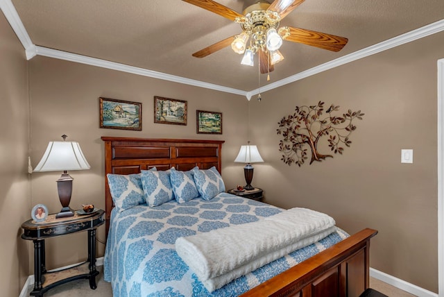 bedroom featuring crown molding, baseboards, a ceiling fan, and carpet flooring
