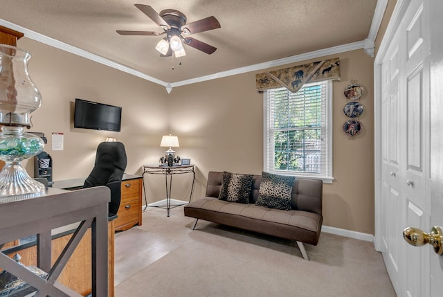 carpeted home office with ceiling fan, crown molding, a textured ceiling, and baseboards