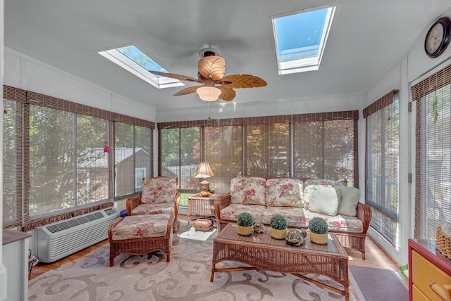 sunroom featuring a skylight, healthy amount of natural light, an outdoor living space, ceiling fan, and lofted ceiling