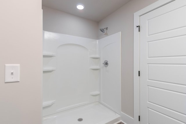 bathroom featuring a shower stall