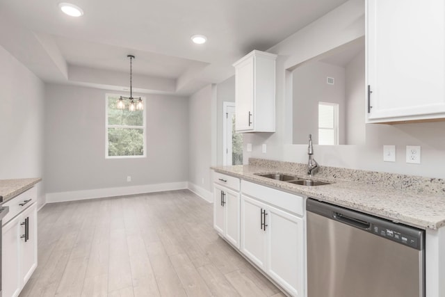 kitchen with a sink, light wood-type flooring, visible vents, dishwasher, and white cabinetry