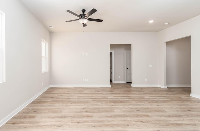spare room featuring baseboards, light wood-style flooring, ceiling fan, and recessed lighting