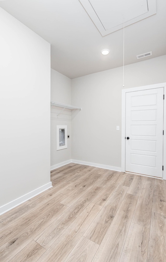 interior space featuring attic access, light wood-type flooring, visible vents, baseboards, and recessed lighting