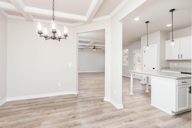 kitchen featuring ceiling fan with notable chandelier, coffered ceiling, white cabinetry, beamed ceiling, and recessed lighting