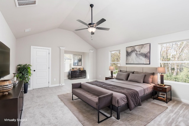 bedroom featuring lofted ceiling, baseboards, visible vents, and light colored carpet