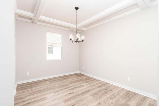spare room featuring coffered ceiling, crown molding, beamed ceiling, light wood-style floors, and a chandelier