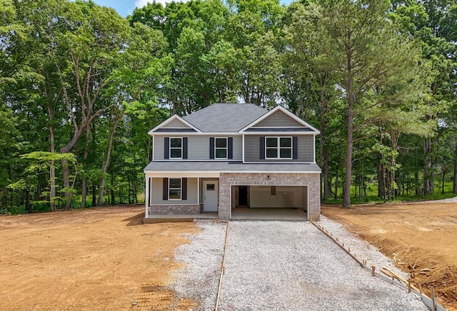 2 Woodland Farms, Dickson, TN 37055 - view of front facade featuring gravel driveway, a porch, and brick siding