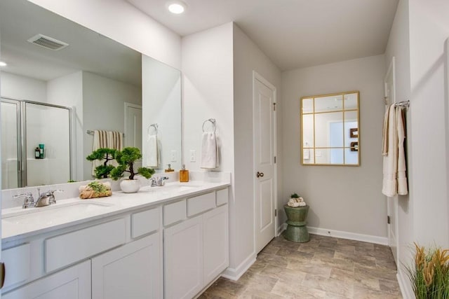 310 Weston Dr, Lewisburg, TN 37091 - bathroom with a shower stall, baseboards, visible vents, and a sink
