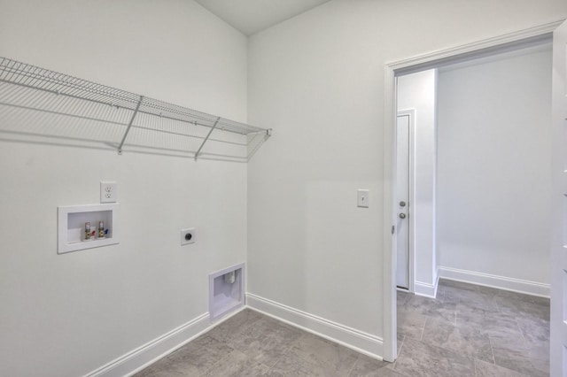 laundry room with laundry area, hookup for an electric dryer, washer hookup, and baseboards