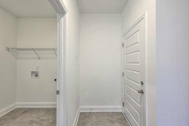 clothes washing area featuring baseboards, hookup for an electric dryer, laundry area, and washer hookup
