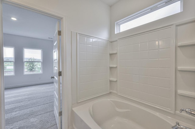 bathroom with bathing tub / shower combination