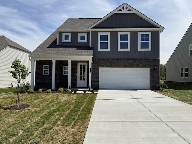 view of front of house featuring board and batten siding, brick siding, a front yard, and driveway