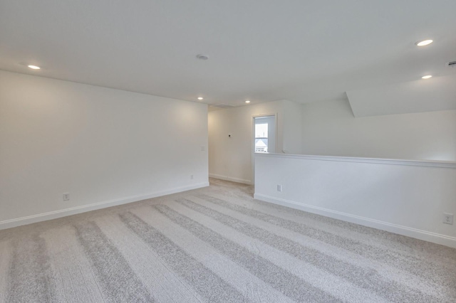 unfurnished room with light carpet, baseboards, visible vents, and recessed lighting