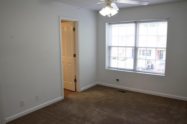 unfurnished room featuring ceiling fan, carpet, baseboards, and visible vents