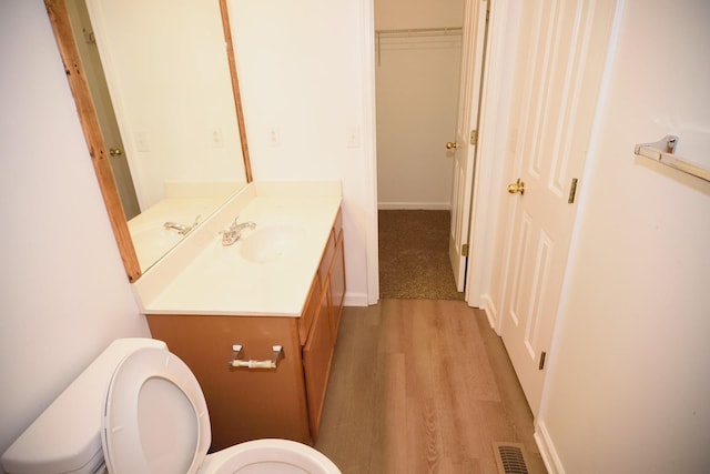 301 Arapaho Dr, Murfreesboro, TN 37128 - bathroom featuring toilet, wood finished floors, vanity, and baseboards