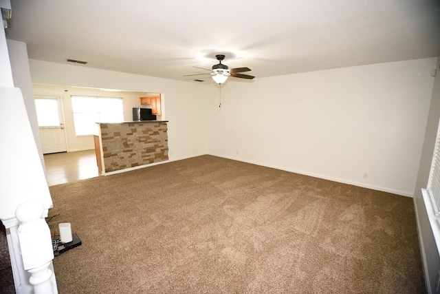 301 Arapaho Dr, Murfreesboro, TN 37128 - unfurnished living room featuring ceiling fan, carpet, and baseboards