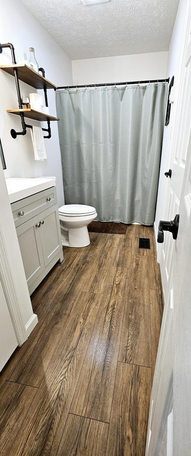 429 E Castle St, Murfreesboro, TN 37130 - full bathroom with vanity, visible vents, a textured ceiling, and wood finished floors