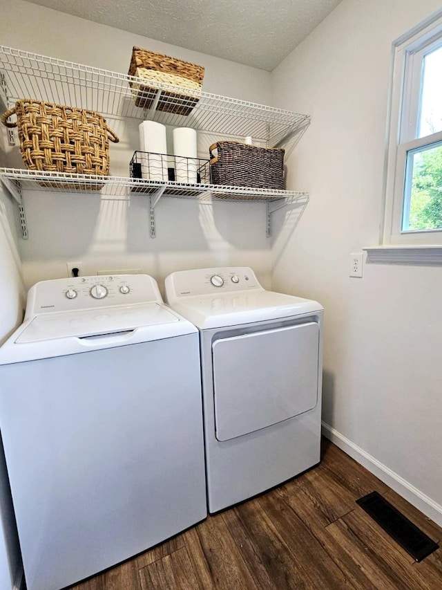 429 E Castle St, Murfreesboro, TN 37130 - laundry room featuring washer and dryer, laundry area, dark wood-type flooring, baseboards, and visible vents