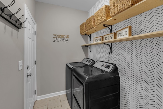 1803 Villa Cir, Lebanon, TN 37090 - laundry area with washing machine and dryer, laundry area, light tile patterned flooring, and baseboards
