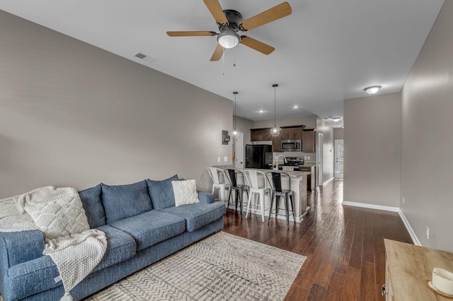 1803 Villa Cir, Lebanon, TN 37090 - living area featuring visible vents, baseboards, a ceiling fan, and dark wood-type flooring