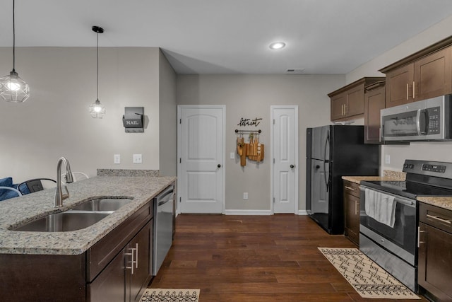 1803 Villa Cir, Lebanon, TN 37090 - kitchen featuring a sink, a peninsula, dark brown cabinets, and appliances with stainless steel finishes