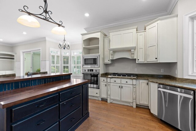 kitchen featuring white cabinetry, wooden counters, stainless steel appliances, and open shelves
