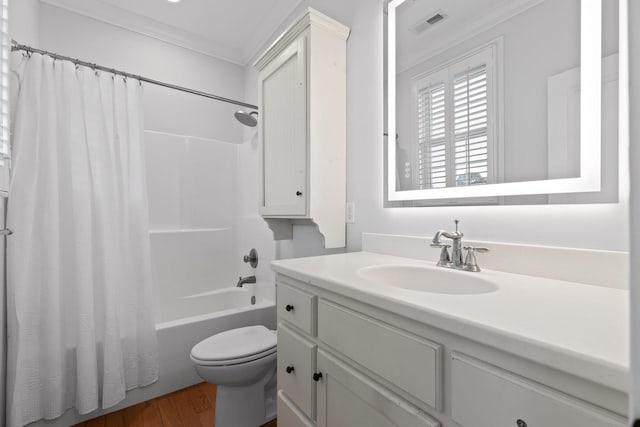 full bathroom with toilet, vanity, crown molding, shower / bathtub combination with curtain, and wood finished floors