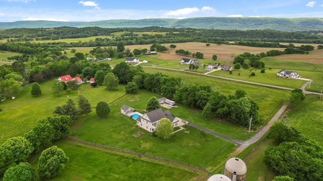 drone / aerial view featuring a rural view and a mountain view