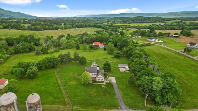 drone / aerial view featuring a rural view and a mountain view