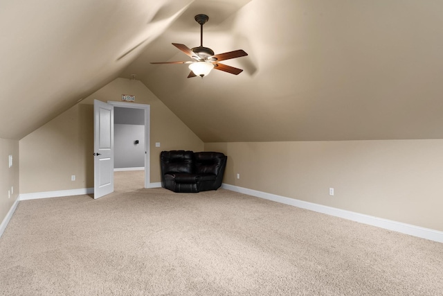 bonus room with baseboards, light carpet, ceiling fan, and vaulted ceiling
