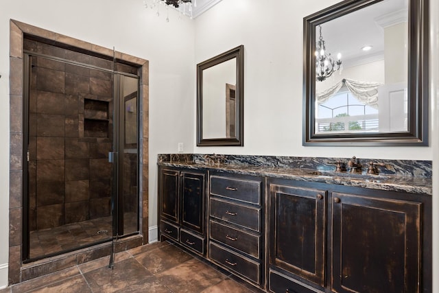 full bath with double vanity, a stall shower, ornamental molding, and a sink