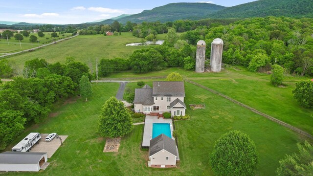 birds eye view of property featuring a water and mountain view