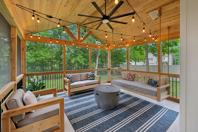 sunroom / solarium with outdoor lounge area, ceiling fan, and rail lighting