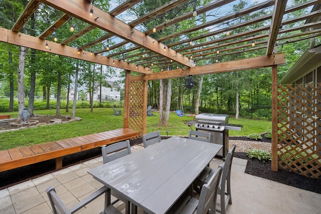 view of patio with a pergola, fence, outdoor dining area, and a grill