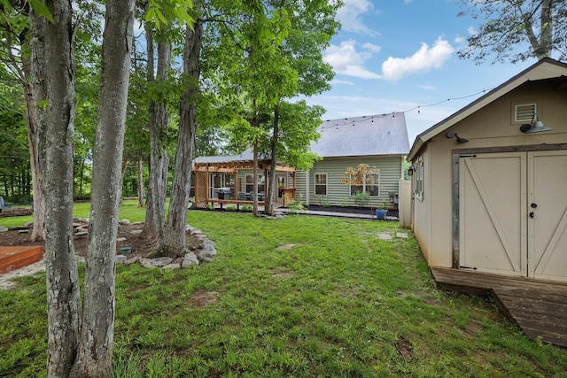 view of yard featuring an outbuilding and a shed