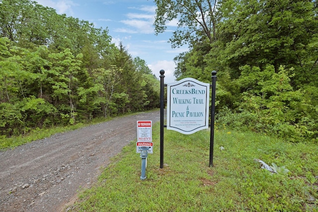 exterior space featuring dirt driveway
