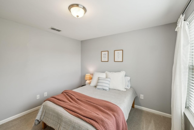bedroom with carpet, baseboards, and visible vents