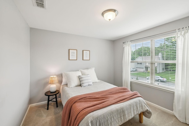 bedroom featuring carpet, baseboards, and visible vents
