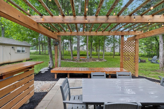 view of patio featuring a pergola and outdoor dining area