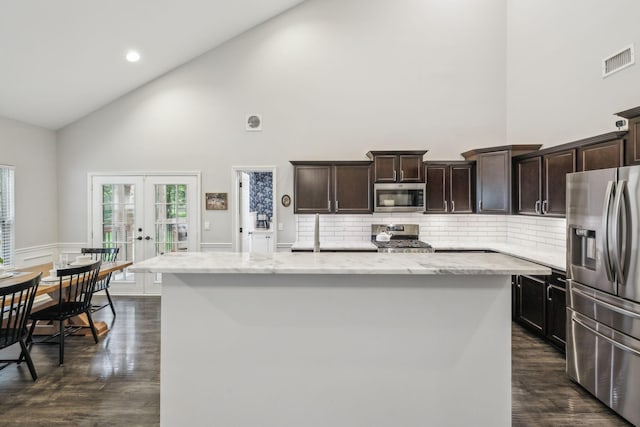 kitchen featuring french doors, dark wood finished floors, visible vents, high vaulted ceiling, and appliances with stainless steel finishes