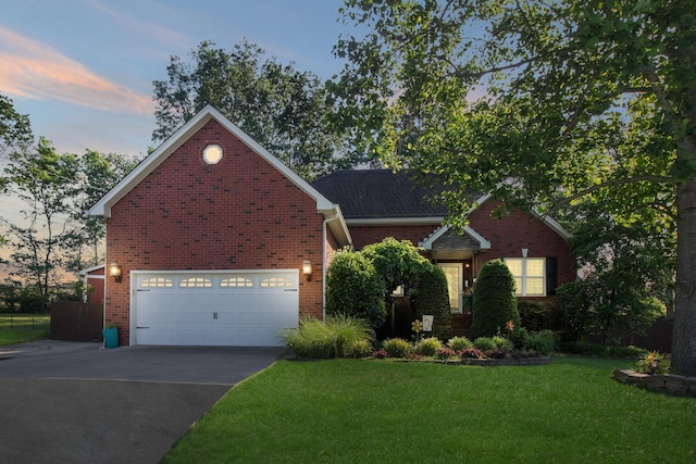 4006 Greentree Ct W, Smyrna, TN 37167 - view of front of property with asphalt driveway, brick siding, a garage, and a front lawn
