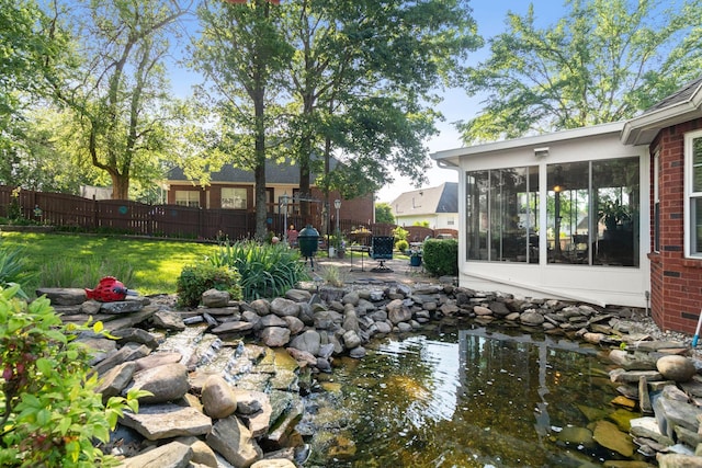 4006 Greentree Ct W, Smyrna, TN 37167 - view of yard featuring a sunroom, a patio, and a garden pond