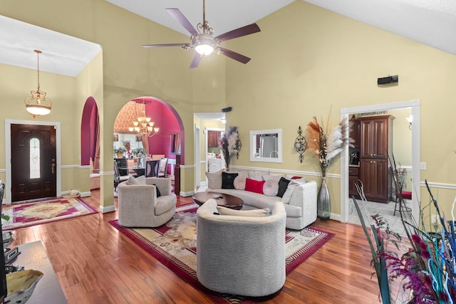 4006 Greentree Ct W, Smyrna, TN 37167 - living area with arched walkways, high vaulted ceiling, ceiling fan, wood finished floors, and a chandelier
